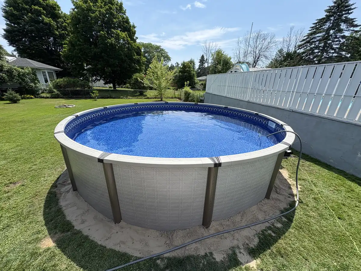New round above ground pool set on a level sand base