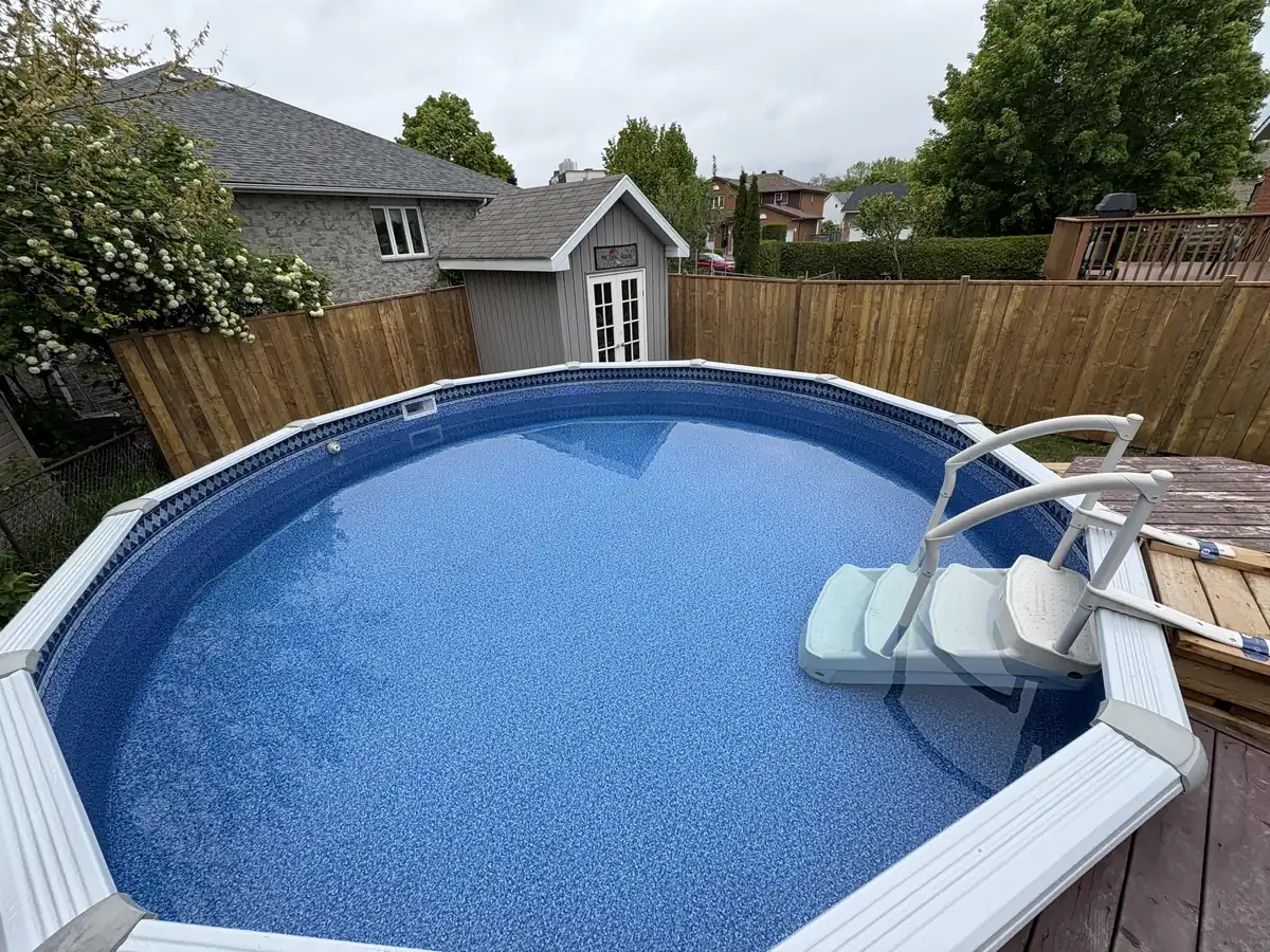 Above ground pool with resin steps and a deck